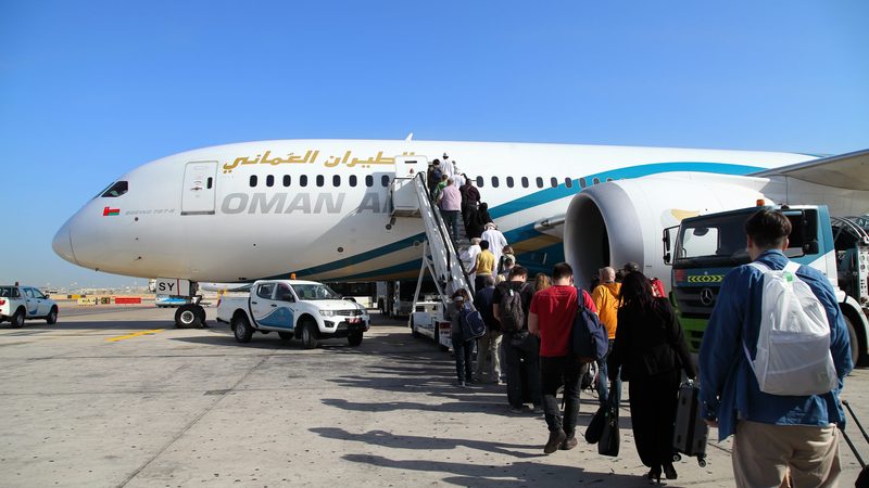 Oman Air revenue people boarding aircraft