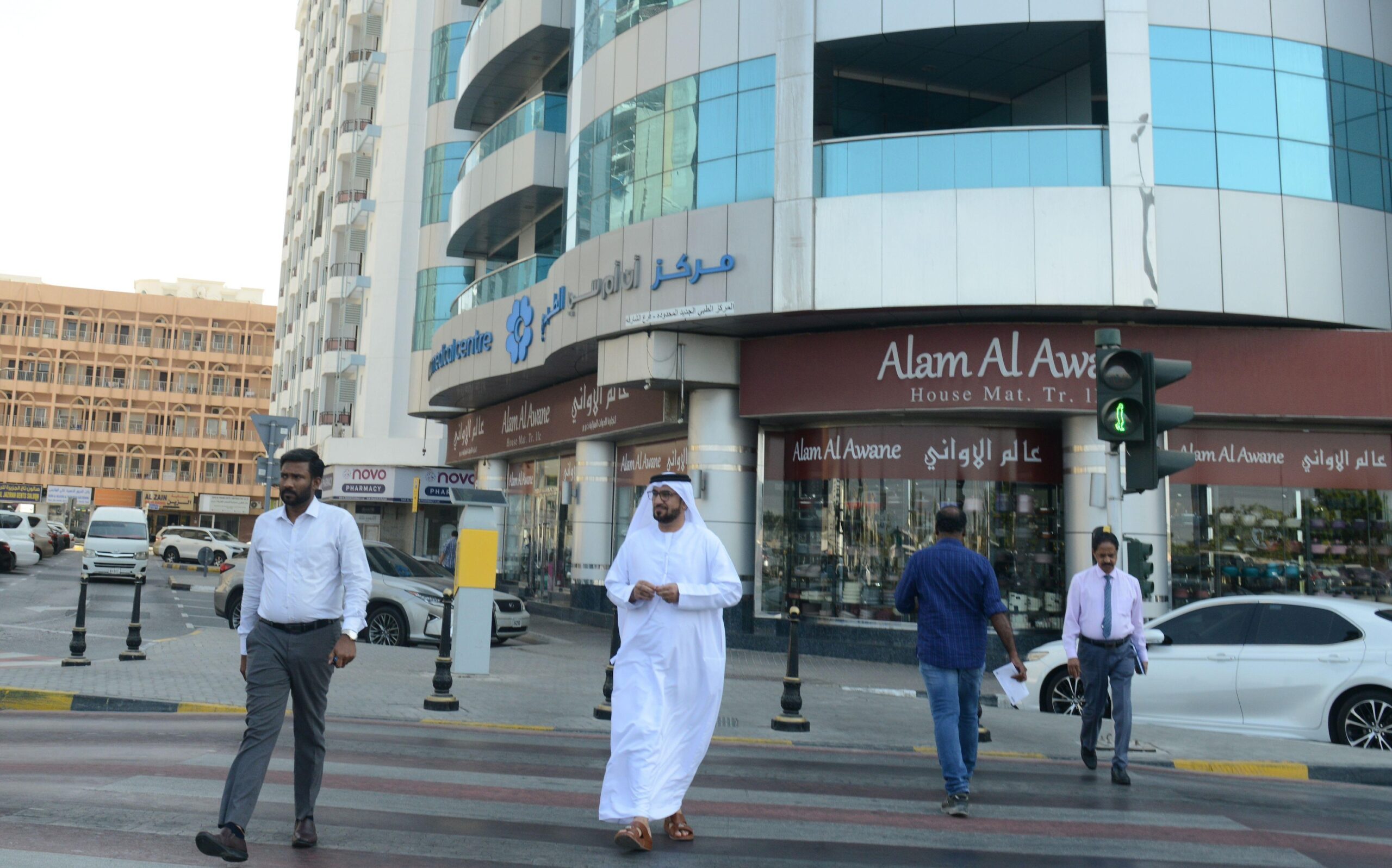 Pedestrians cross a road in Sharjah. The emirate is the UAE's 'manufacturing base', according to an official