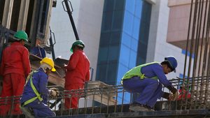 Foreign labourers work at the construction site of a building in Riyadh Foreign workers on a building site in Riyadh; thousands of migrants who have the right to work in Saudi Arabia could have their work permit fees covered for four years from the date of recognition