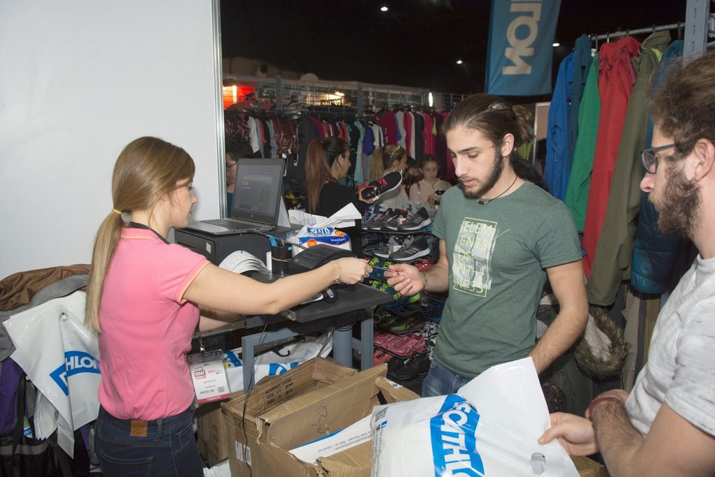 A customer paying with a credit card inside the Black Friday Market in Beirut. Lebanon wants more people to move away from cash