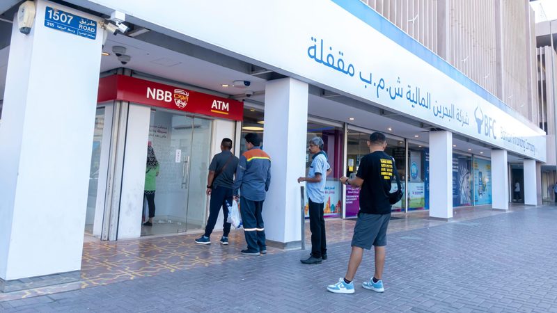 Customers queue for the National Bank of Bahrain. A merger of NBB and Bank of Bahrain and Kuwait would be in the top 30 of GCC entities