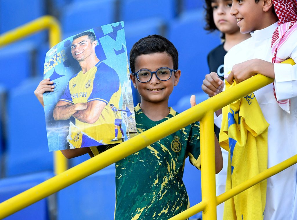 A young Cristiano Ronaldo fan pictured at an Al Nassr Saudi Pro League match. The star has approximately 849 million social media followers