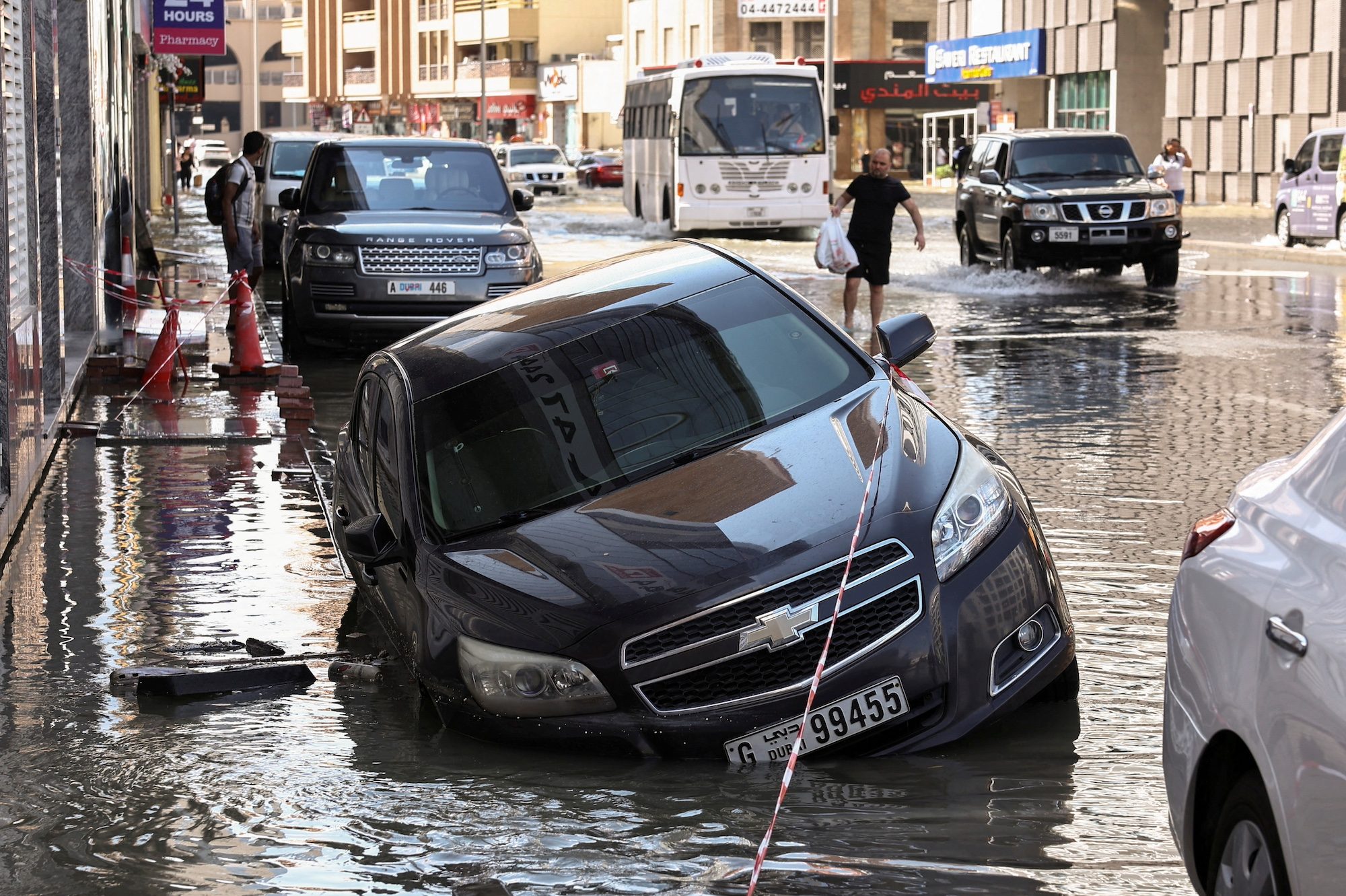 A car is stranded in flood water caused by heavy rains, in Dubai, United Arab Emirates, April 17, 2024. REUTERS/Amr Alfiky