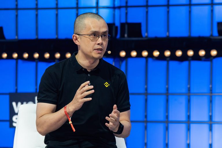 Changpeng Zhao, seen addressing a tech summit in 2022, has been sentenced to 4 months in prison. He has stepped down as Binance CEO