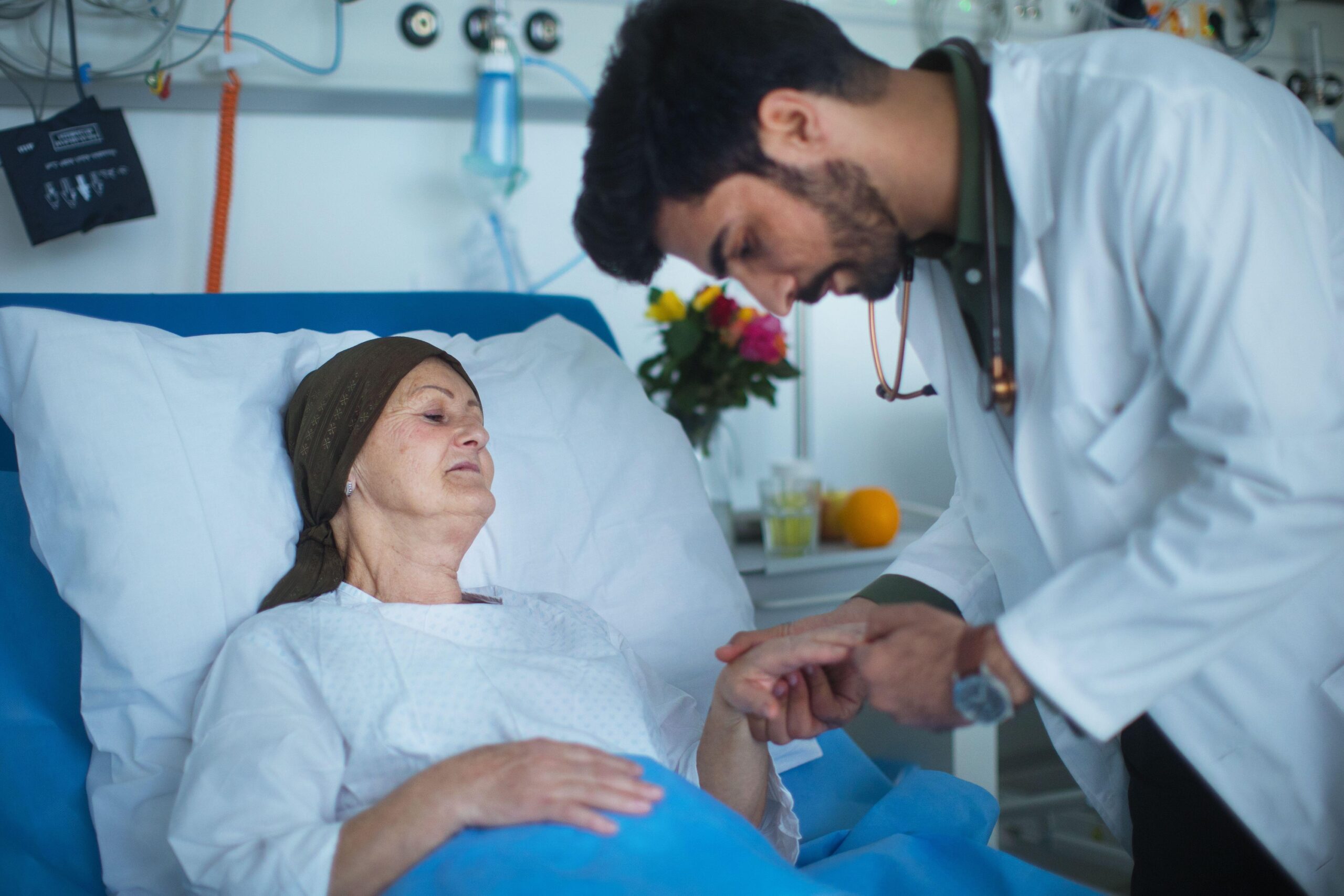 A hospital doctor examines a cancer patient. Fakeeh, which runs four Saudi hospitals, is selling a 21.47% stake through its IPO