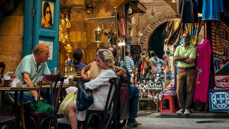 Tourists stop for a breather at a cafe in Cairo's Khan el Khalili souq. About 14.9m people visited Egypt in 2023