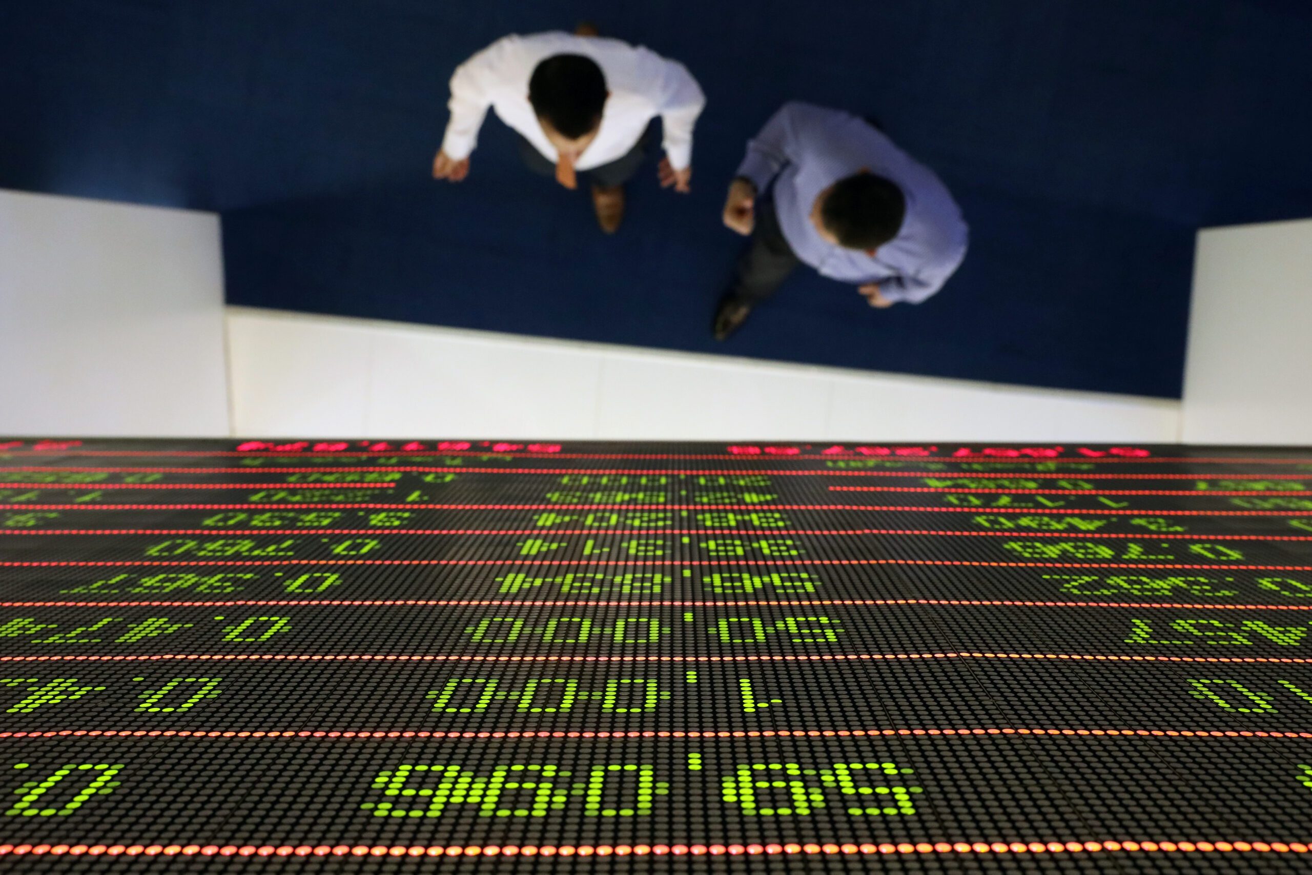 Investors at the Dubai Financial Market. Drake & Scull was suspended from trading in 2018