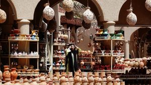 A seller at a souq in Oman. The country has been given a stable outlook, thanks to the positive impact of budget reforms and falling debt