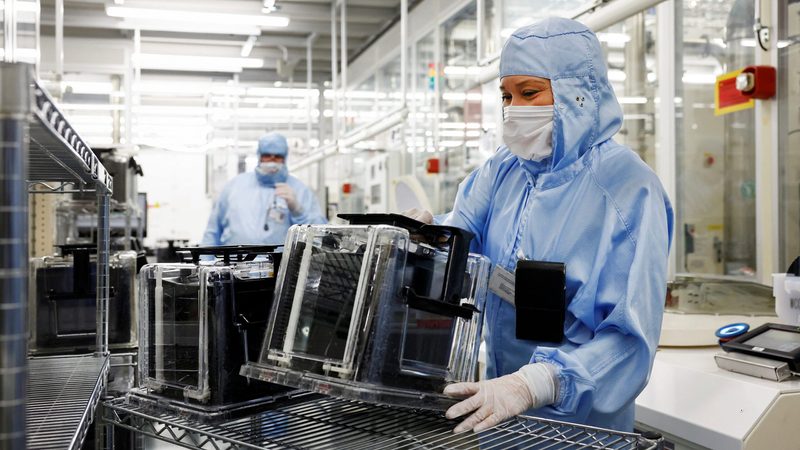 Workers at a semiconductor plant in the Netherlands. Qatar's investment in France's Ardian comes as global demand for semiconductor chips is surging