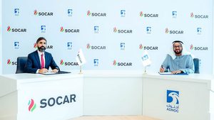 Socar president Rovshan Najaf and Adnoc upstream executive director Abdulmunim Saif Al Kindy sign the concession award