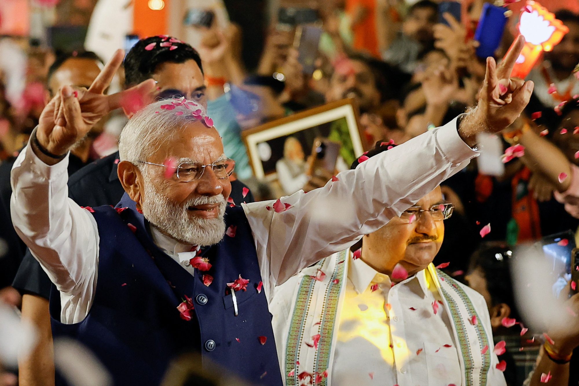 PM Narendra Modi greets supporters at BJP headquarters in New Delhi. He took office in 2014