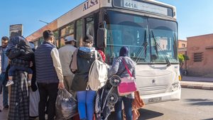Passengers board a bus in central Marrakech, Morocco. Aside from new buses, the government will also upgrade related infrastructure