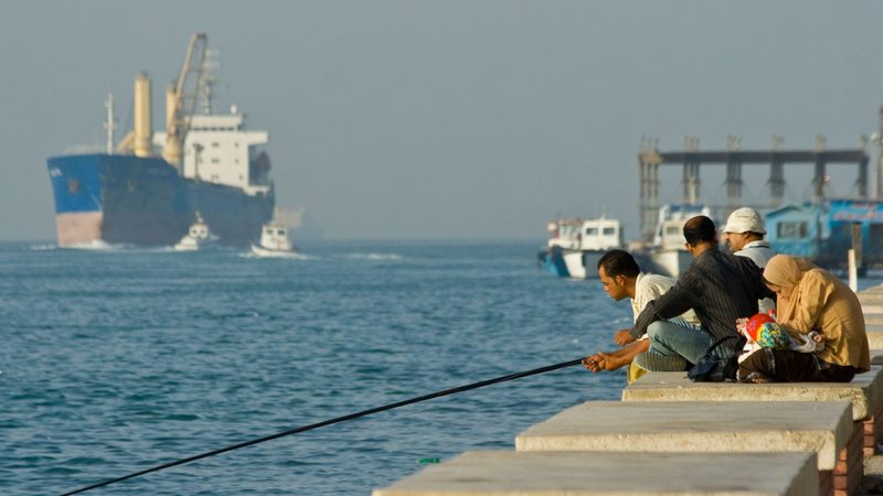 A cargo ship passes through the Suez Canal