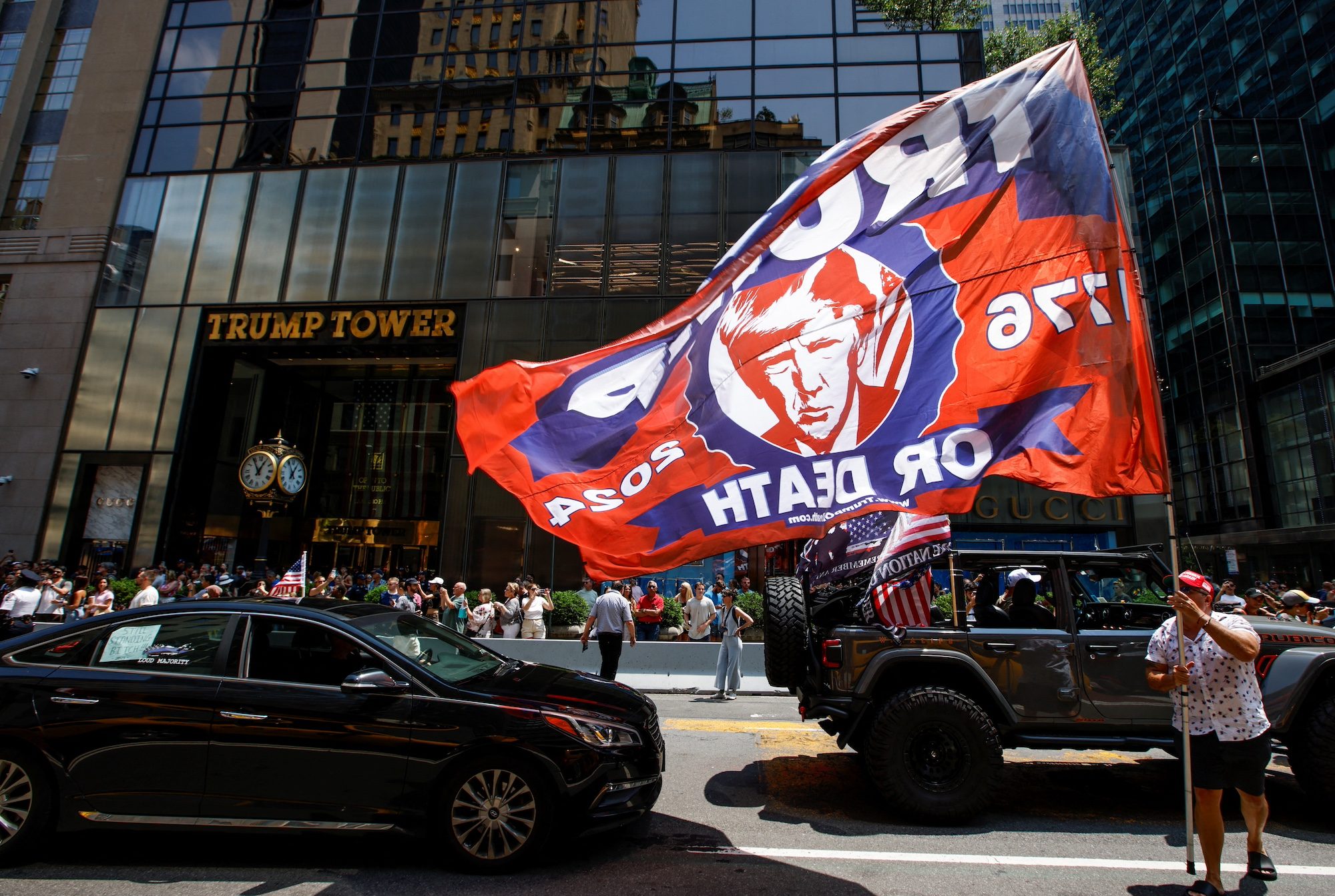 Trump supporters gather outside Trump Tower in New York following the assassination attempt; as a developer, Trump is expected to favour the property sector
