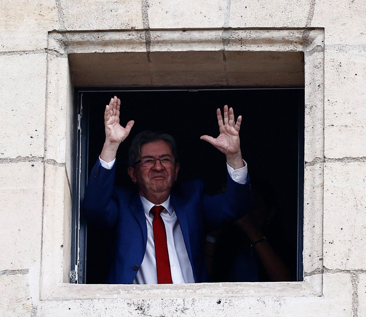 Jean-Luc Mélenchon waves to supporters