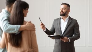 Real estate broker agent couple buying a property Dubai real estate