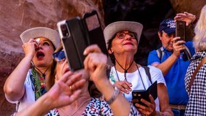 A group of tourists sees Petra for the first time. Visitor numbers from Europe and North America are down sharply