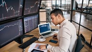 A trader monitors prices. Recent Dubai IPOs have been heavily oversubscribed