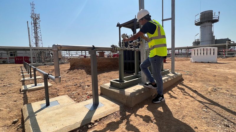 An engineer works on electricity turbines partially powered by green hydrogen in Sharm El-Sheikh, Egypt