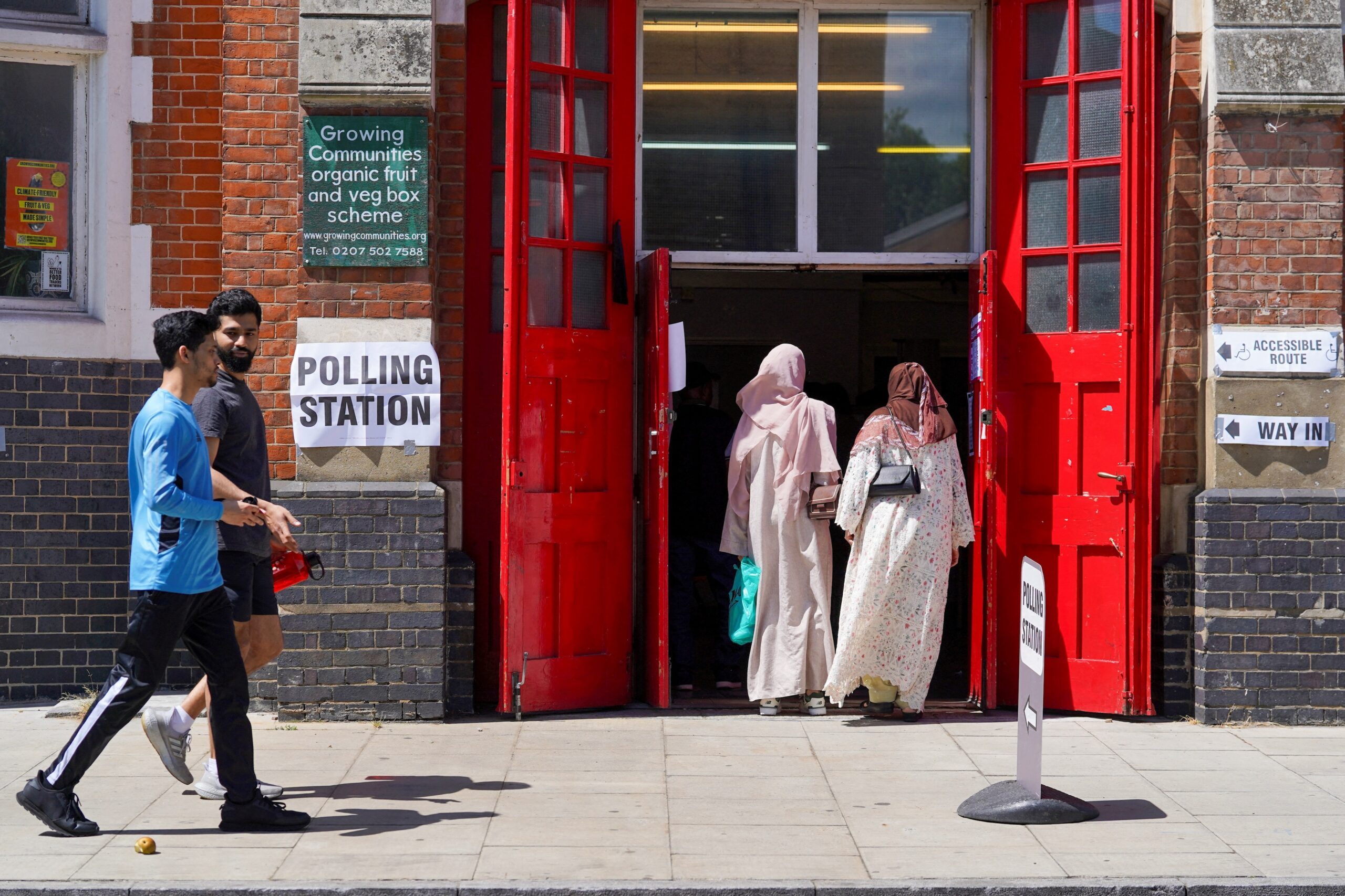 No fuss: women enter a London polling station to vote in the UK general election