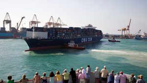 Passengers on a cruise ship watch activities in Jeddah port, Saudi Arabia