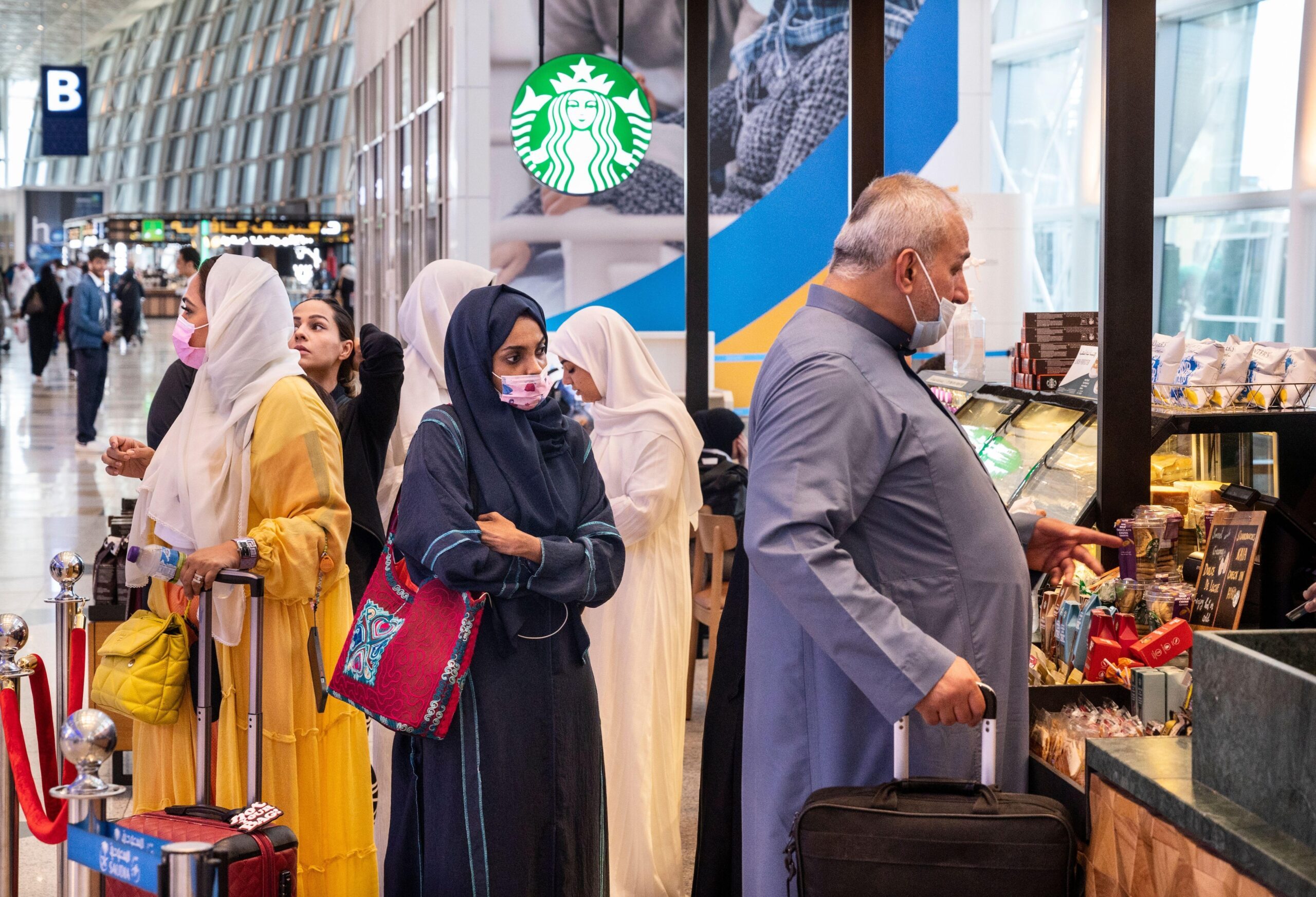 Customers queue at a Starbucks in Jeddah airport. Saudi wealth fund PIF has decreased its Starbucks call options by 138,800 shares