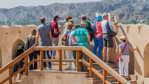 Tourists visiting Nizwa Fort in Oman. Tourism is estimated to account for 7.6% of Oman's GDP by the end of this year