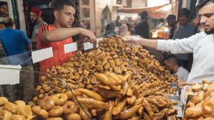 Traditional Tunisian sweets for sale in the busy market of Tunis Medina, the historical Kasbah is a World Heritage Site and popular tourist destination in Tunisia. Shopping for traditional sweets in the medina in Tunis. Tunisia's government has refused to cut subsidies for fear of unrest