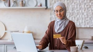 Saudi e-commerce woman shopping on laptop The growth in e-commerce is aligned with government efforts to attract venture capital and promote small businesses