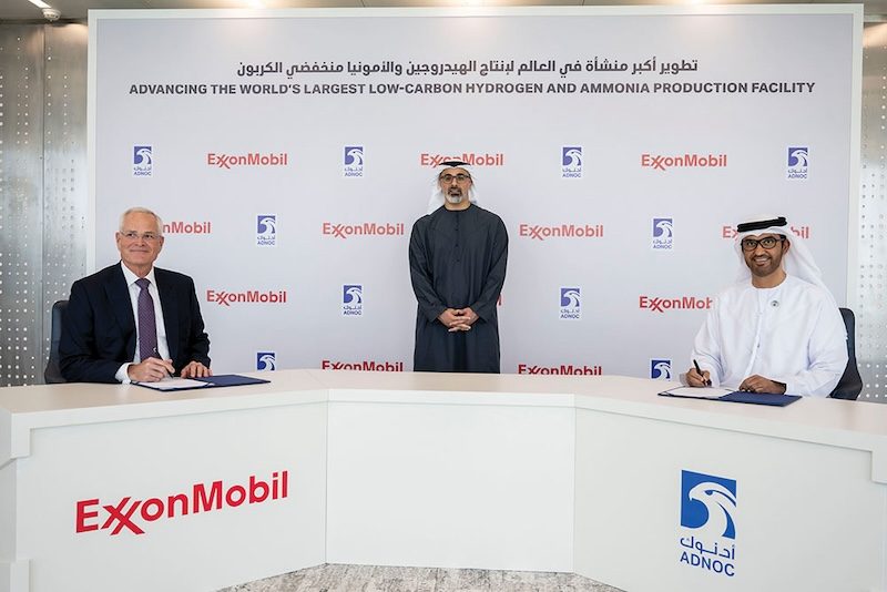 ExxonMobil chairman Darren Woods and Adnoc Group CEO Sultan Ahmed Al Jaber sign the agreement in the presence of Abu Dhabi crown prince Sheikh Khaled bin Mohamed bin Zayed Al Nahyan