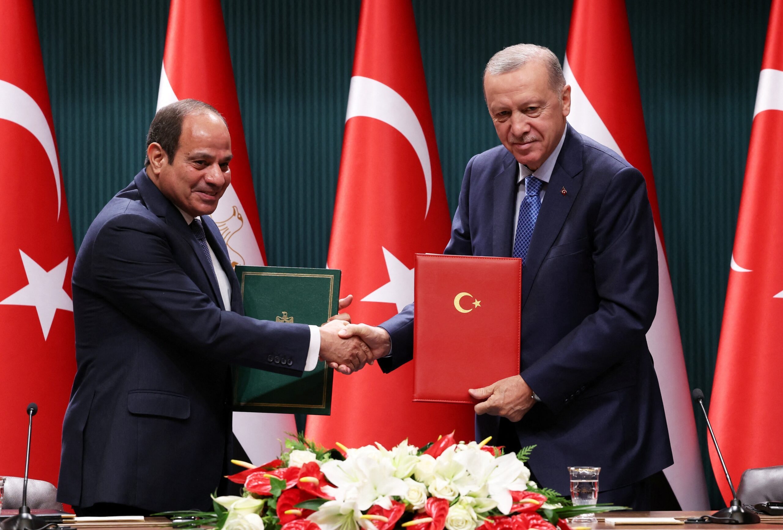 Egyptian president Abdel Fattah Al-Sisi and Turkish president Recep Tayyip Erdoğan shake hands after a signing ceremony in Ankara