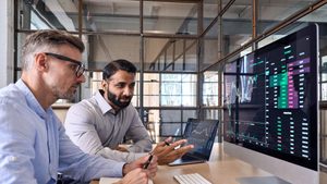 Crypto traders brokers stock exchange investors analyzing trading charts.
