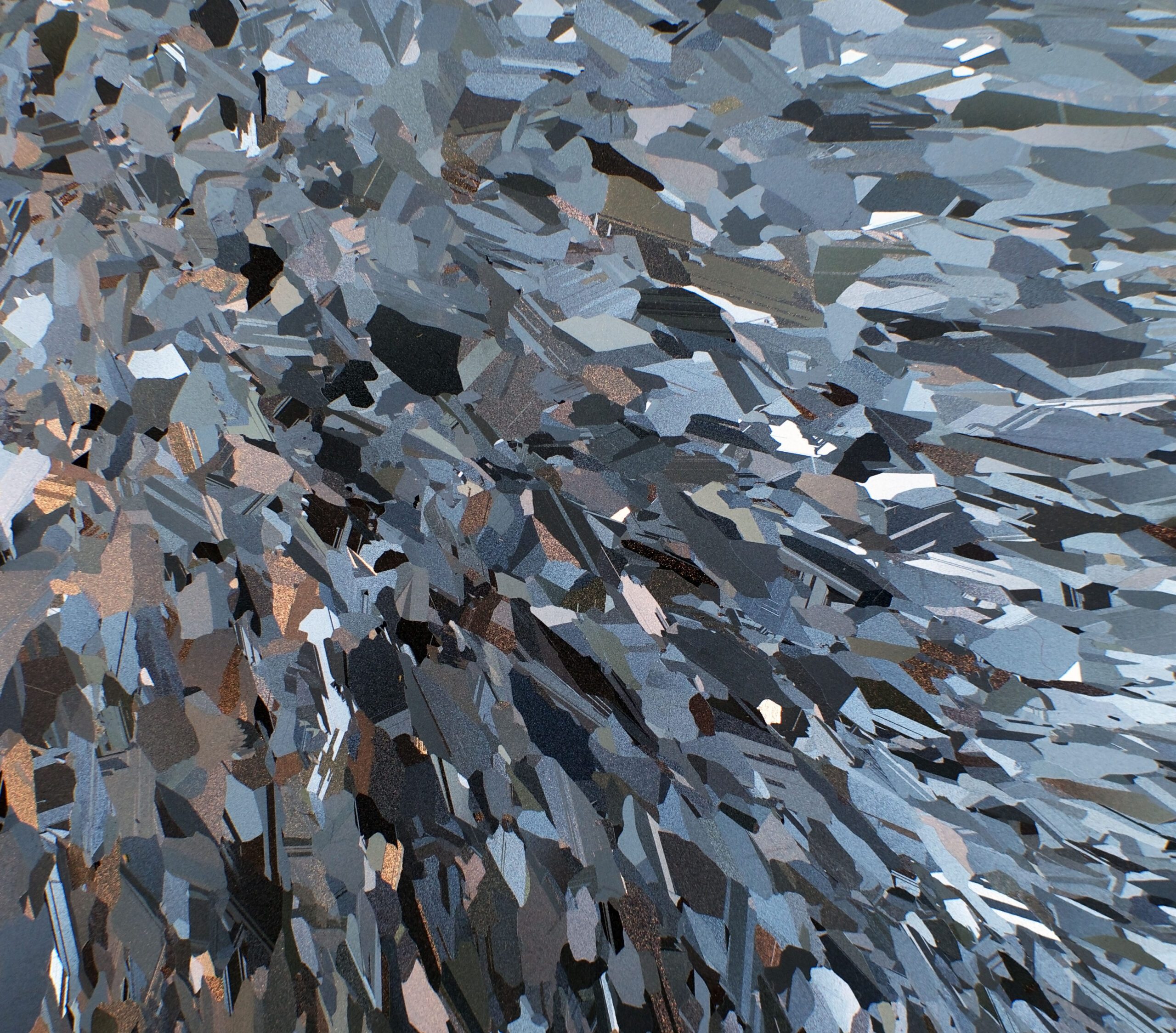 Polysilicon – polycrystalline silicon – is dervied from silicon, usually sand, using the electricity-intensive Siemens Process