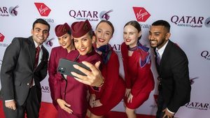 Qatar Airways and Virgin Australia employees take a selfie. Virgin Australia plans to launch flights from Brisbane, Melbourne, Perth and Sydney to Doha by mid-2025