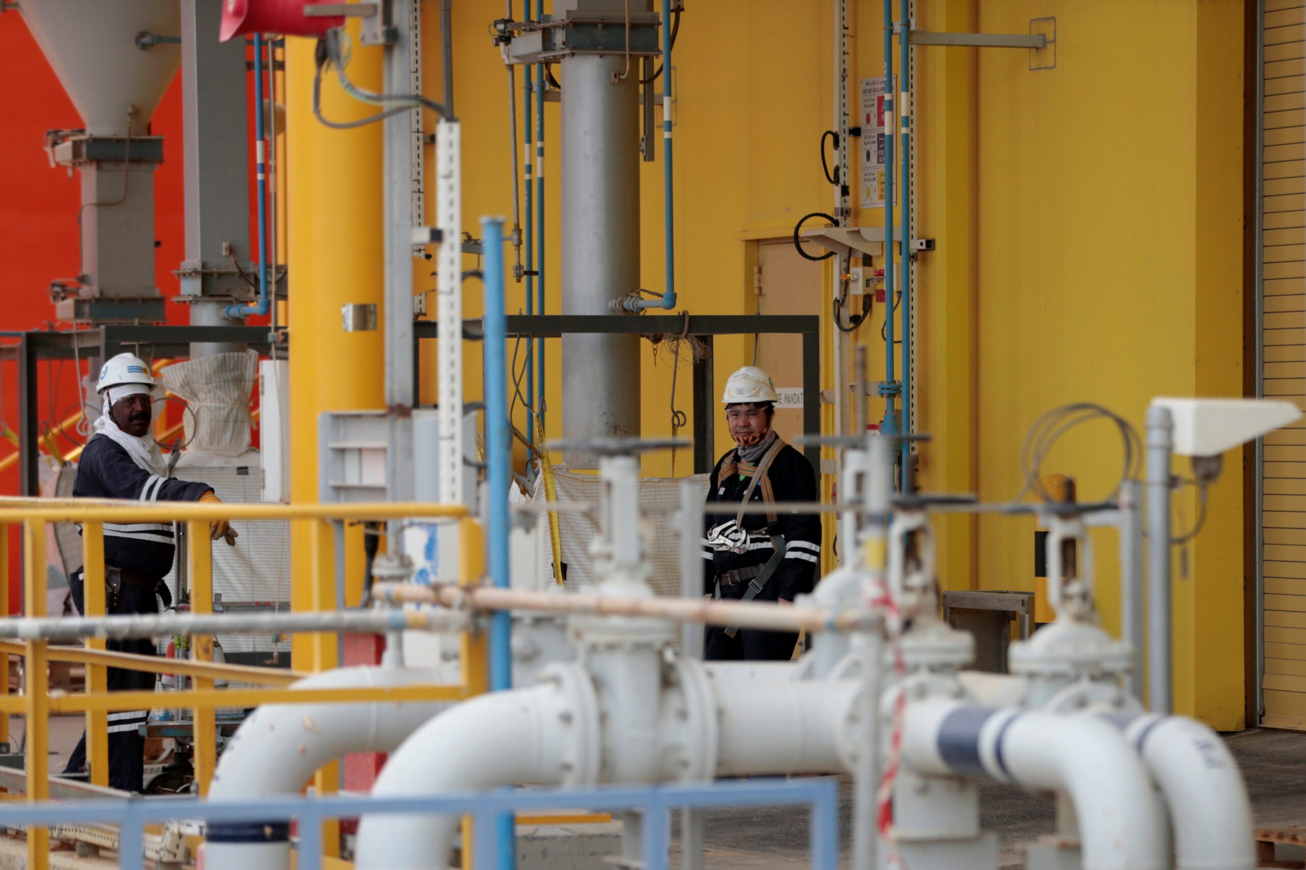 Workers are seen at the Borouge petrochemical facility at ADNOC's Ruwais Industrial Complex in Ruwais, United Arab Emirates May 14, 2018.