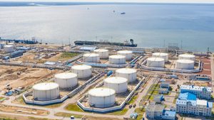 Oil tanks and a cargo ship ready to transport crude. Saudi Arabia sold 5.75m barrels per day in September