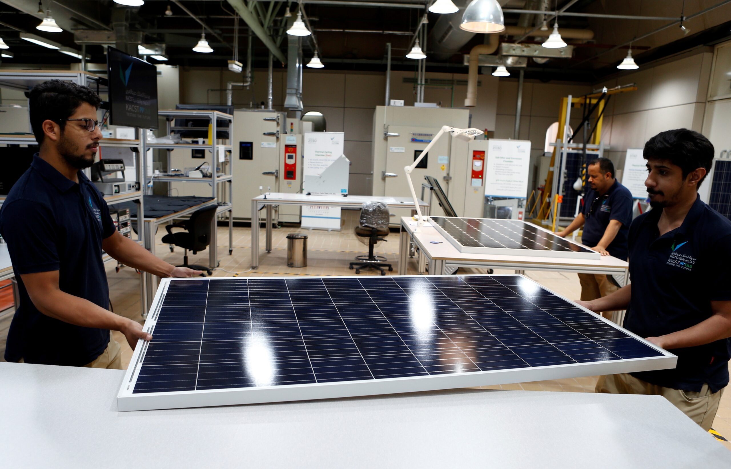 Workers at a solar panel factory in Uyayna, Saudi Arabia. The country's main non-oil trading partners are China, India, Japan and South Korea