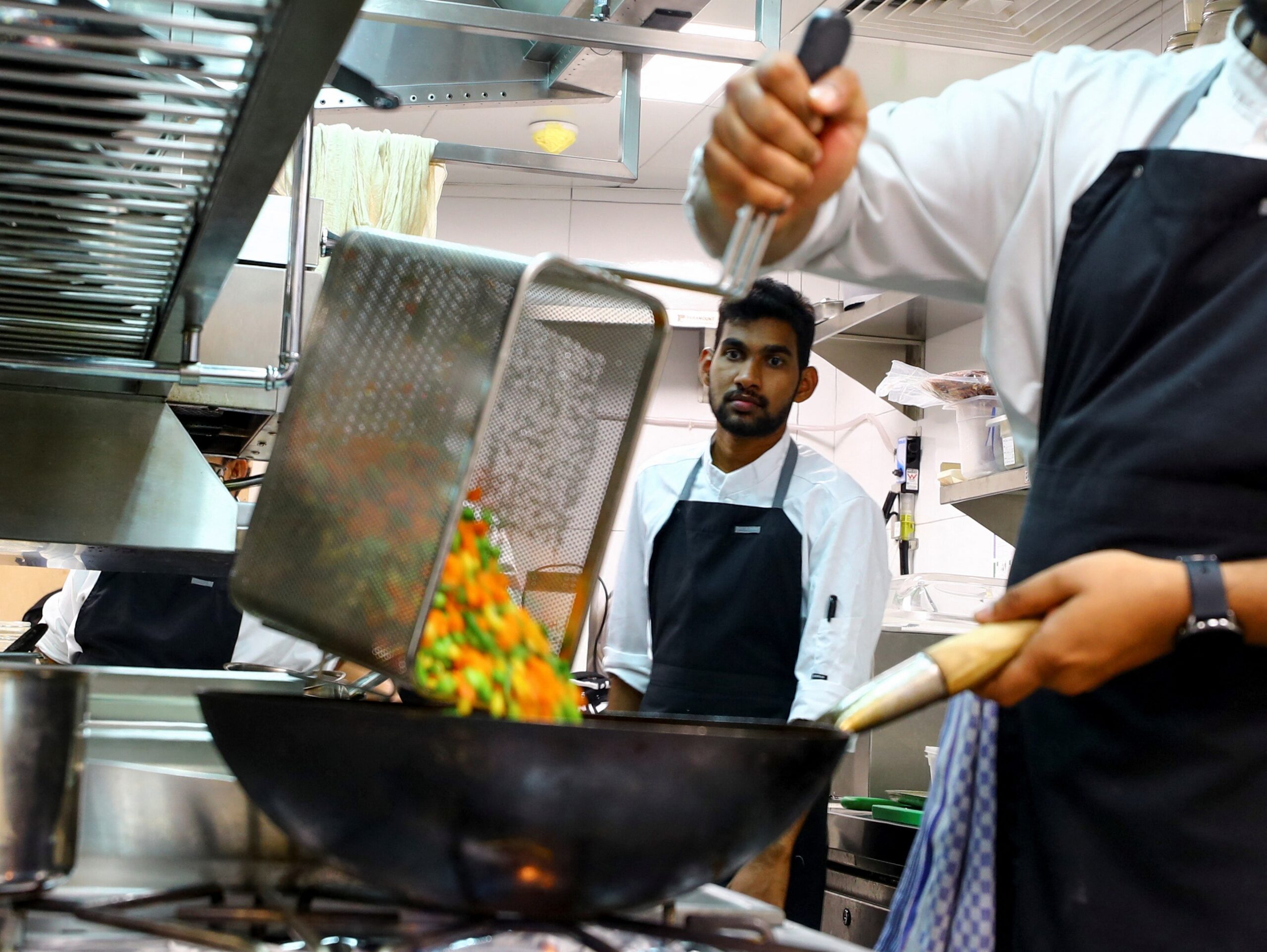 Chefs prepare food in a Dubai restaurant, where the sector is said to be close to saturation point