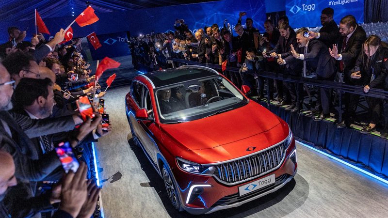 Turkish president Recep Tayyip Erdoğan drives a Togg car at the opening ceremony of a factory to begin mass production