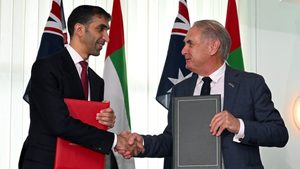 UAE foreign trade minister Dr Thani bin Ahmed Al Zeyoudi and Australian trade minister Don Farrell shake hands at the signing of the Australia-UAE Cepa in November