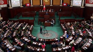 Tunisian prime minister Kamel Madouri speaks in parliament during a session to discuss the 2025 budget