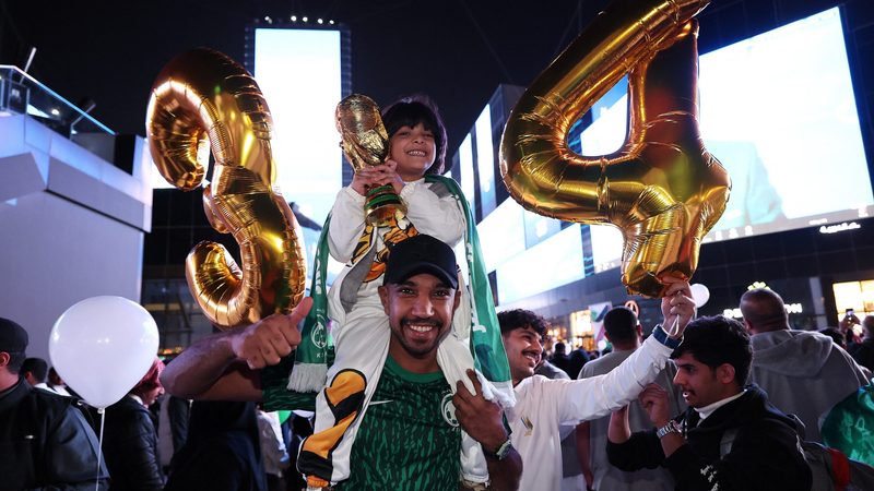 People celebrate after Saudi Arabia is awarded the 2034 World Cup. As well as new stadiums, the country is preparing 134 training centres