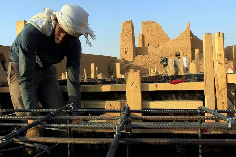 A worker restoring the Diriyah district. Excavated materials will be crushed and repurposed for road bases and landscaping