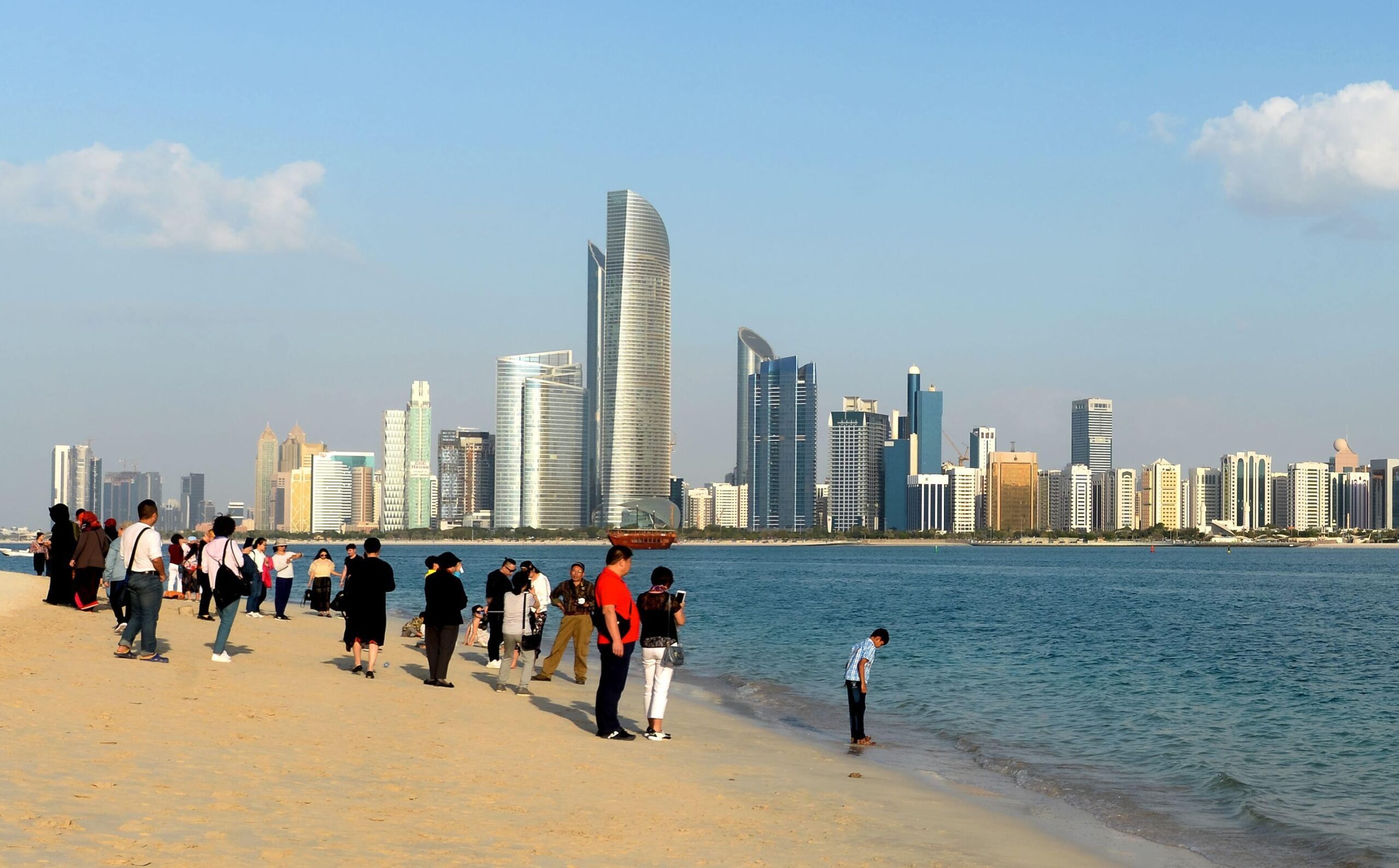 Tourists view the Abu Dhabi skyline. Most visitors come from India, China, Russia, the UK and Saudi Arabia