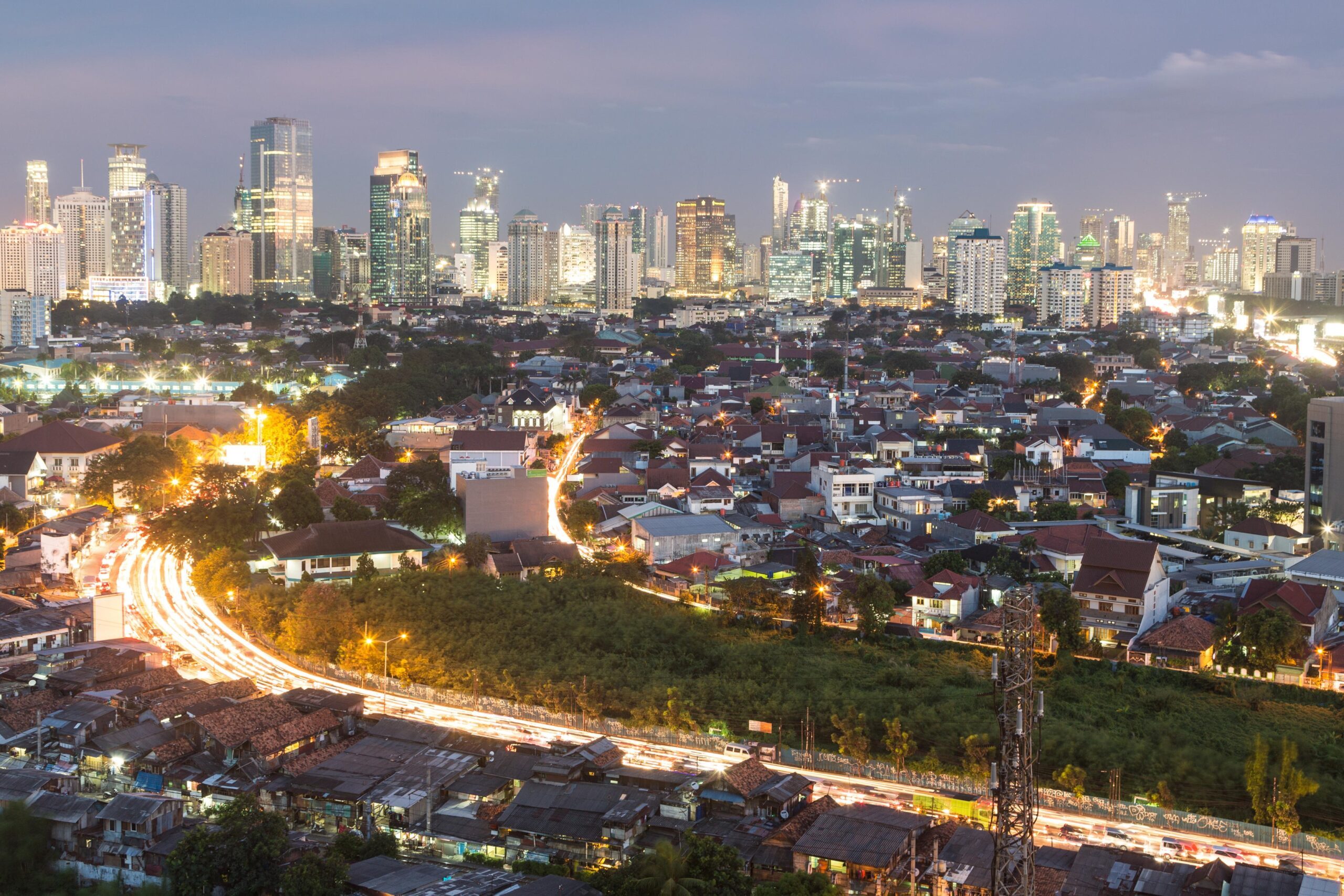 Jakarta's skyline blends colonial architecture with modern skyscrapers. Abu Dhabi and Qatar will support Indonesia's 15-million-home, five-year plan