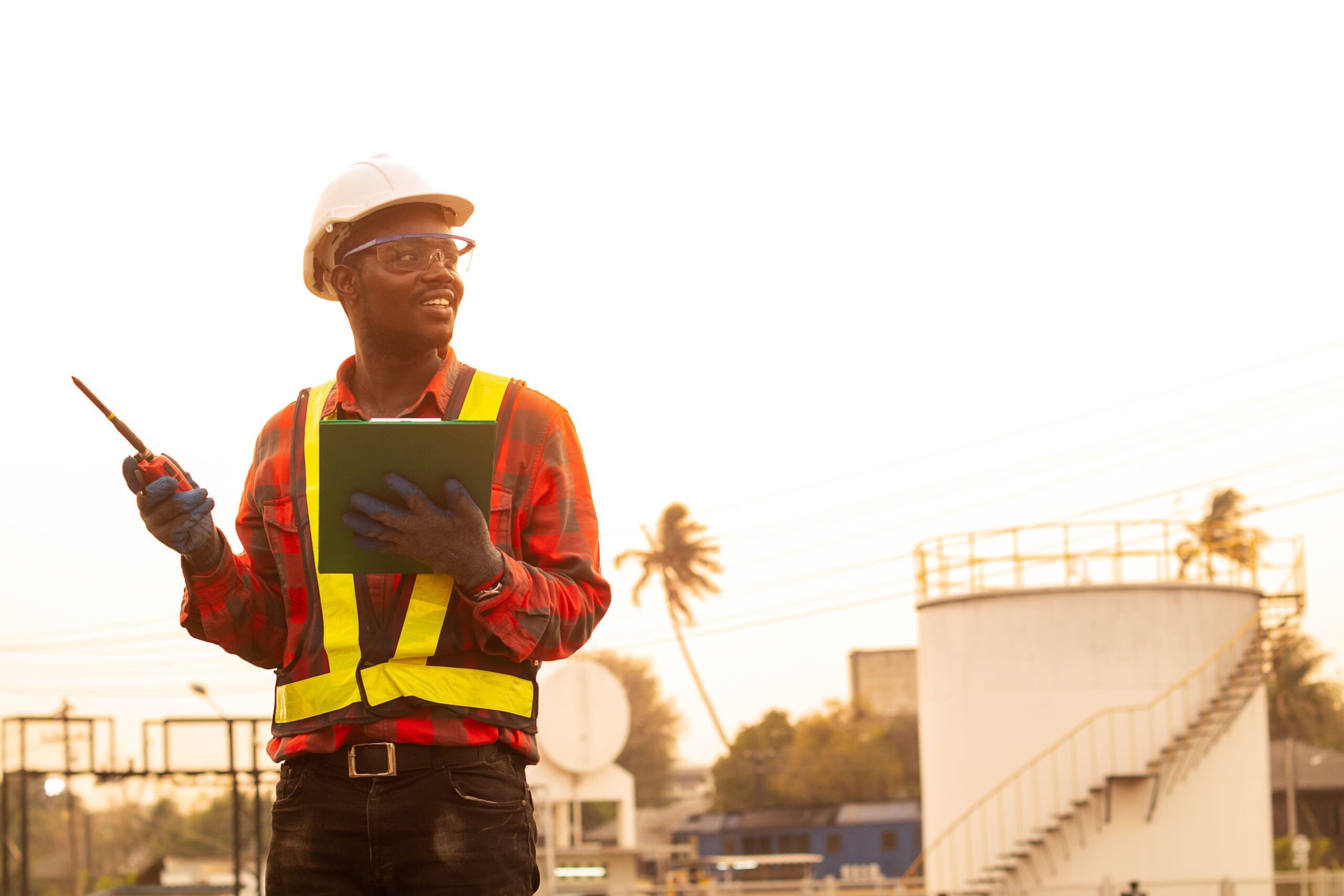 African man engineer use radio communication working at oil industrial