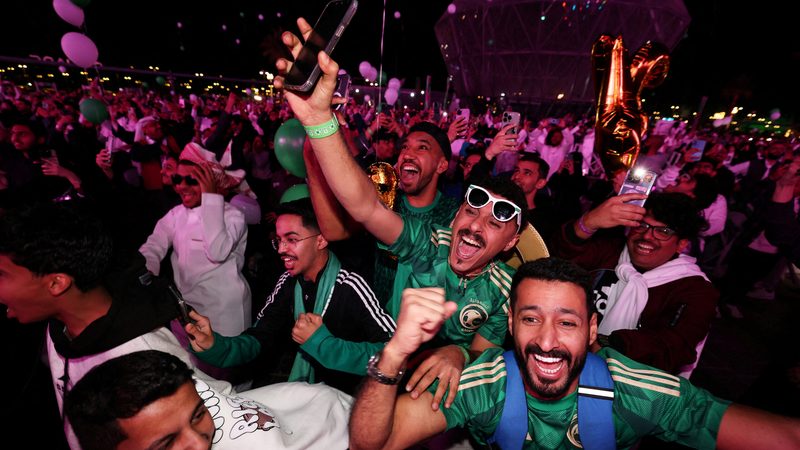 Fans celebrate as Saudi Arabia is announced as the host nation for the Fifa World Cup 2034