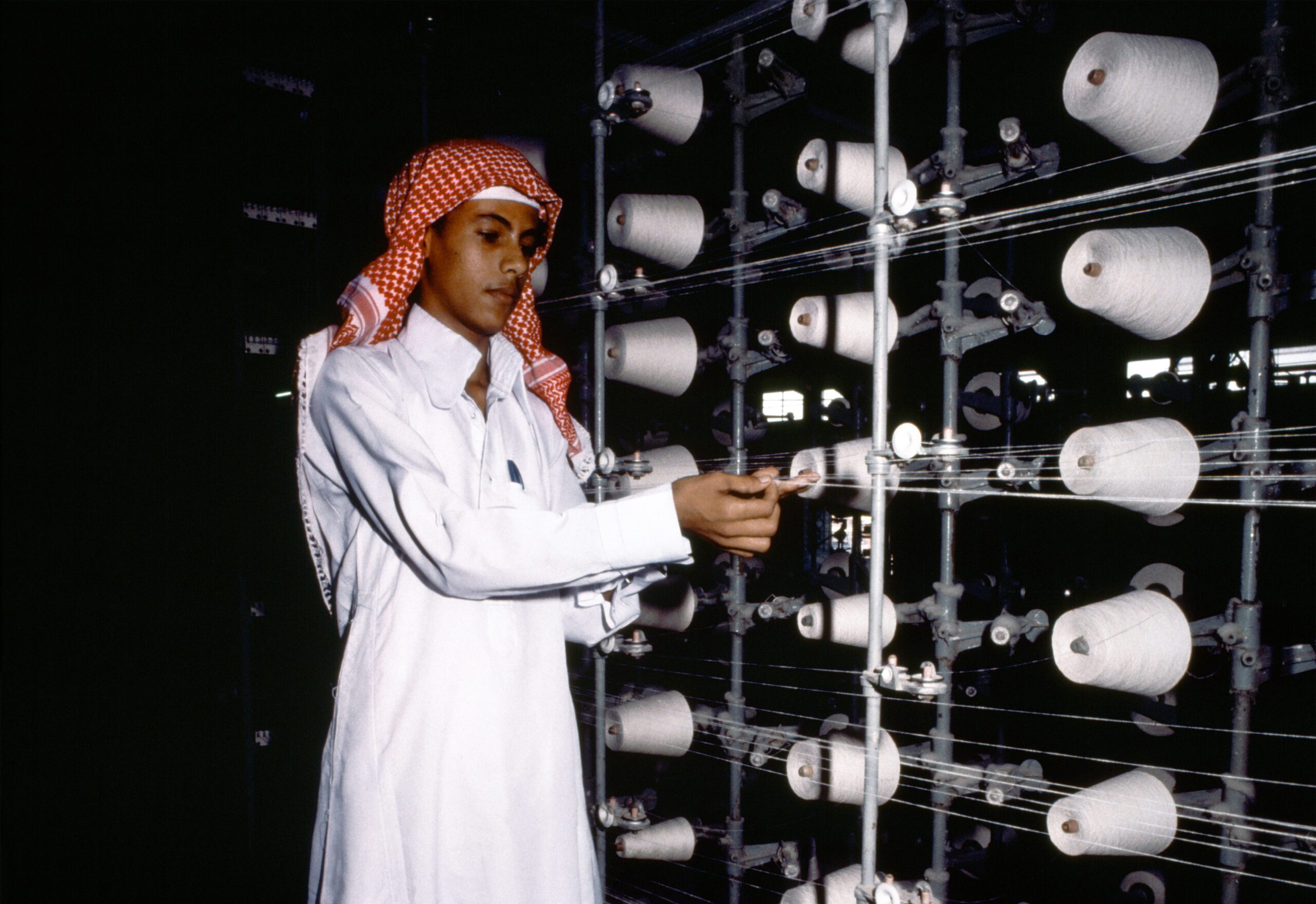 PMI november Saudi man in textile factory
