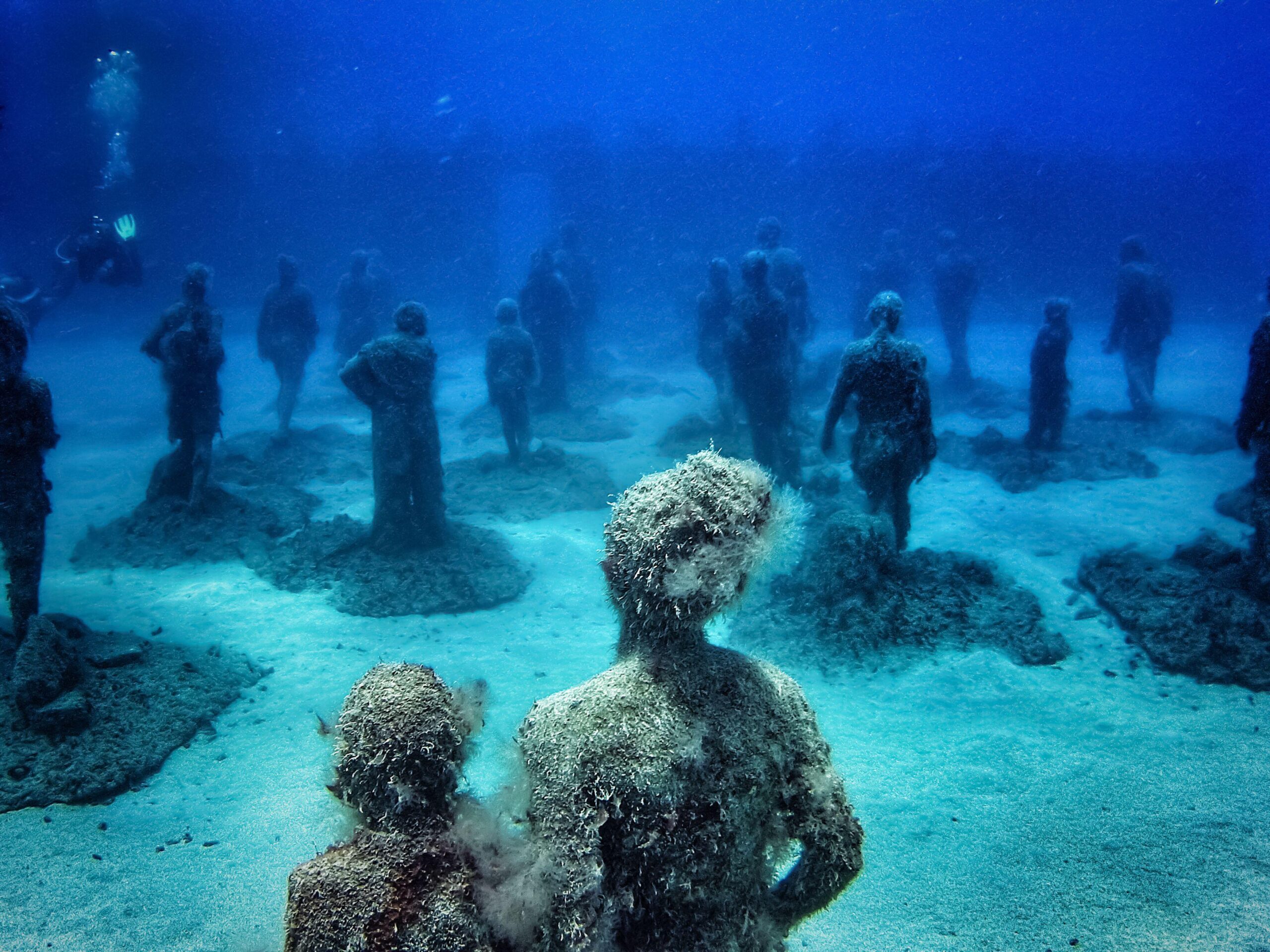 Crossing the Rubicon" underwater sculpture by artist Jason deCaires Taylor in the Museo Atlantico underwater museum off Playa Blanca, Spain. underwater marine museum
