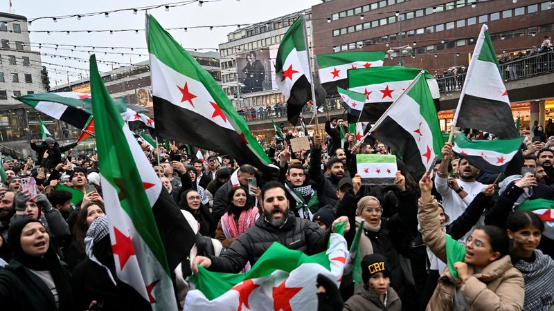 Syrians celebrate the ousting of Bashar al-Assad. The resulting uncertainty in Syria ranks low among geopolitical factors influencing oil markets